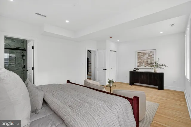 a bedroom with a bed and a couch