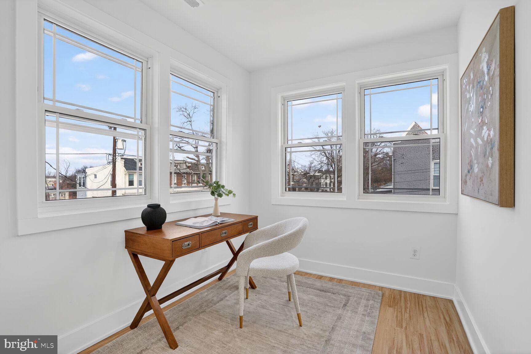 4629 9th Street Northwest Washington, DC 20011 - Photo 25 of 41 a living room with furniture and a window