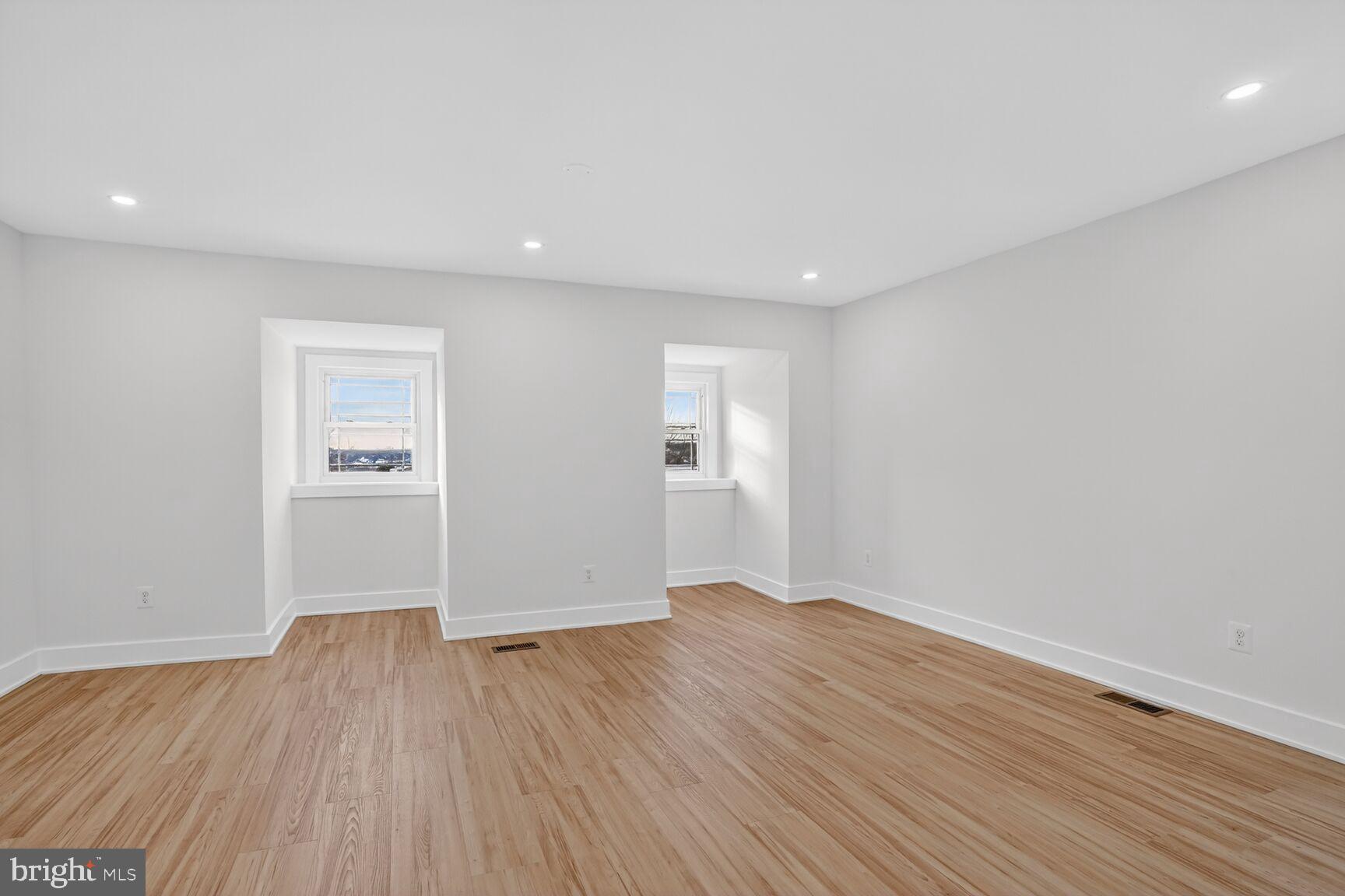 4629 9th Street Northwest Washington, DC 20011 - Photo 26 of 41 an empty room with wooden floor and windows
