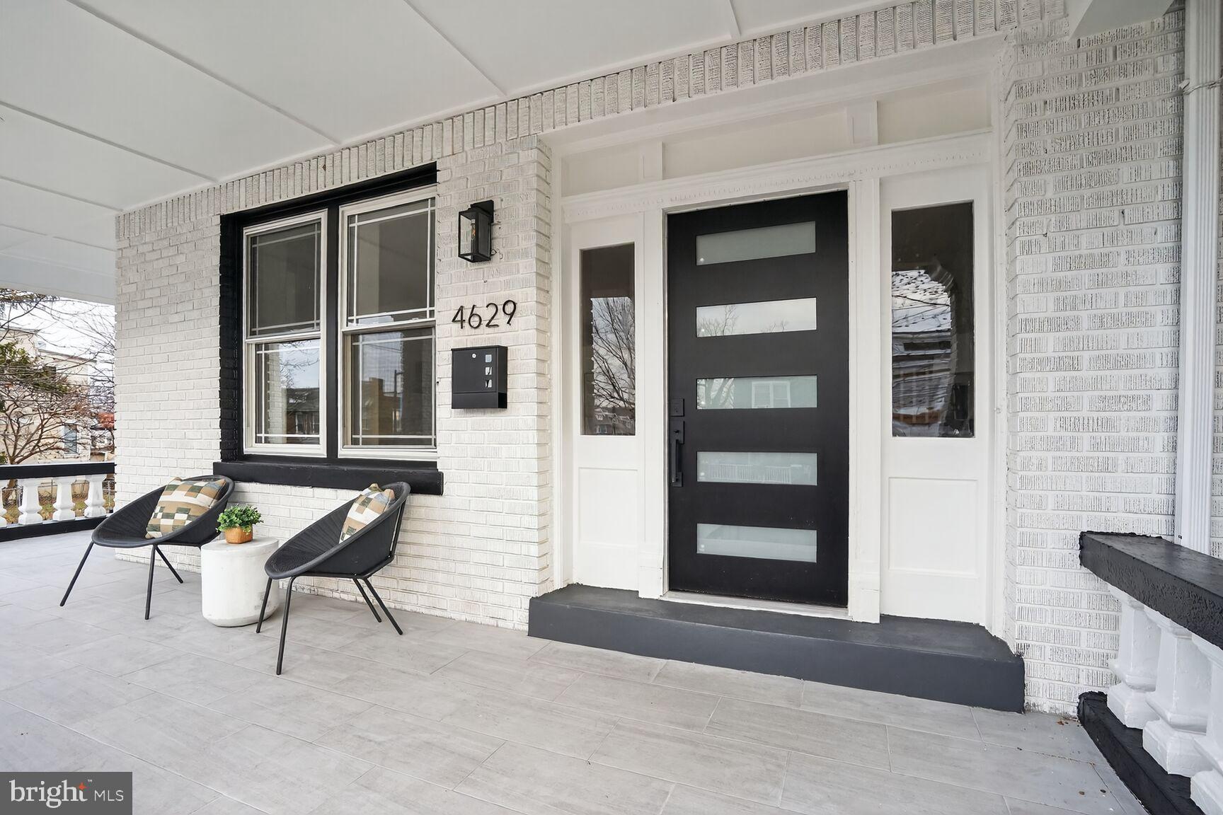 4629 9th Street Northwest Washington, DC 20011 - Photo 3 of 41 a balcony with table and chairs