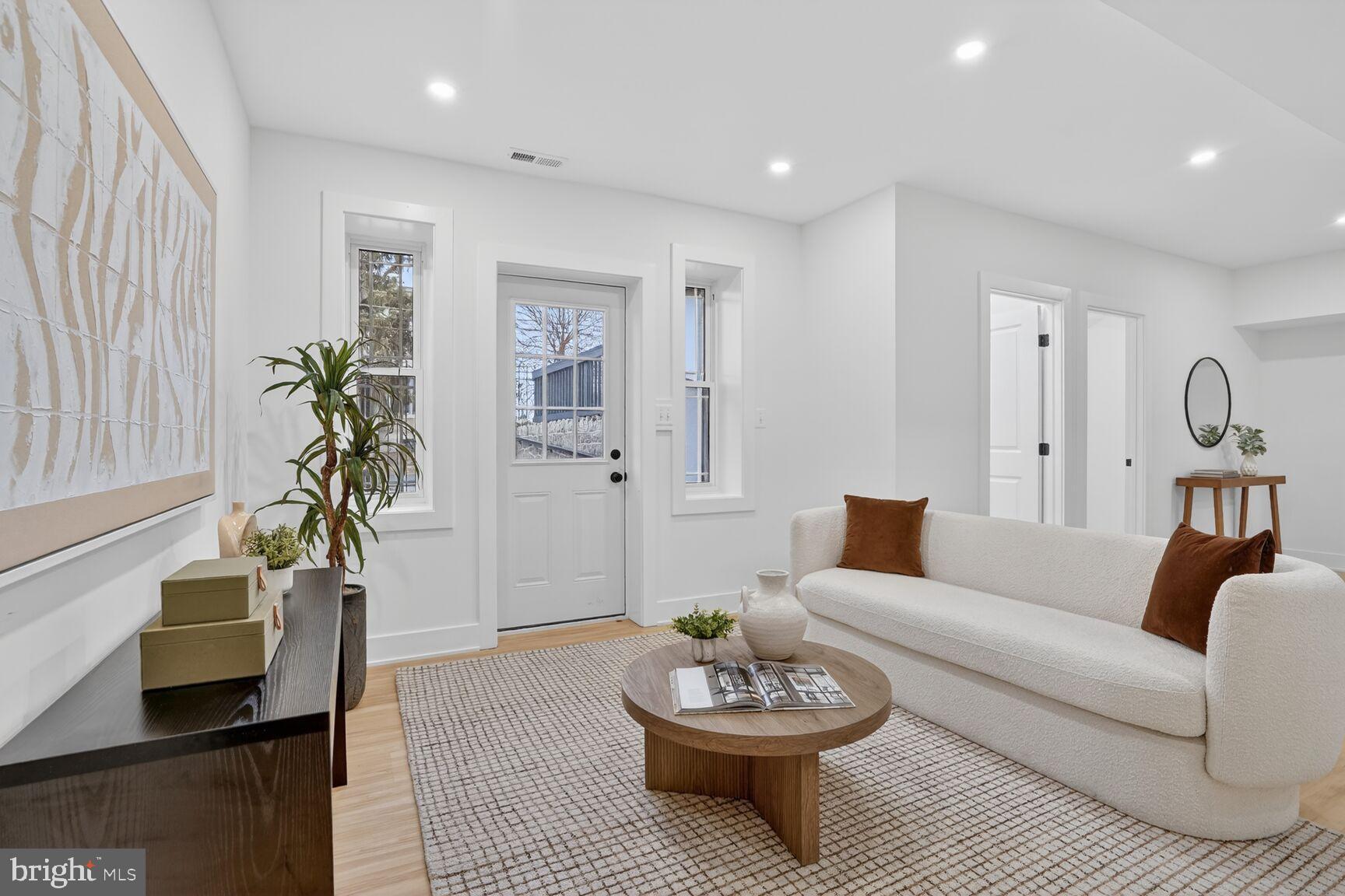 4629 9th Street Northwest Washington, DC 20011 - Photo 33 of 41 a living room with furniture and wooden floor
