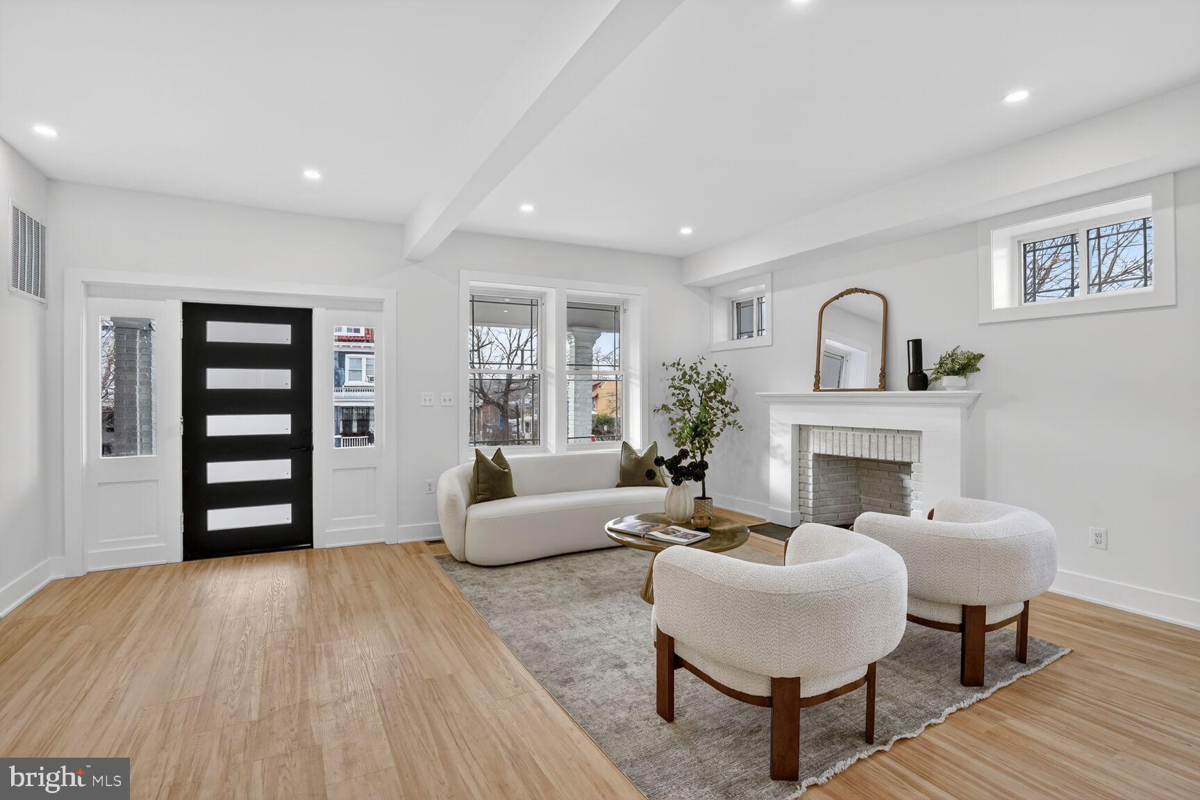 4629 9th Street Northwest Washington, DC 20011 - Photo 7 of 41 a living room with furniture and a fireplace