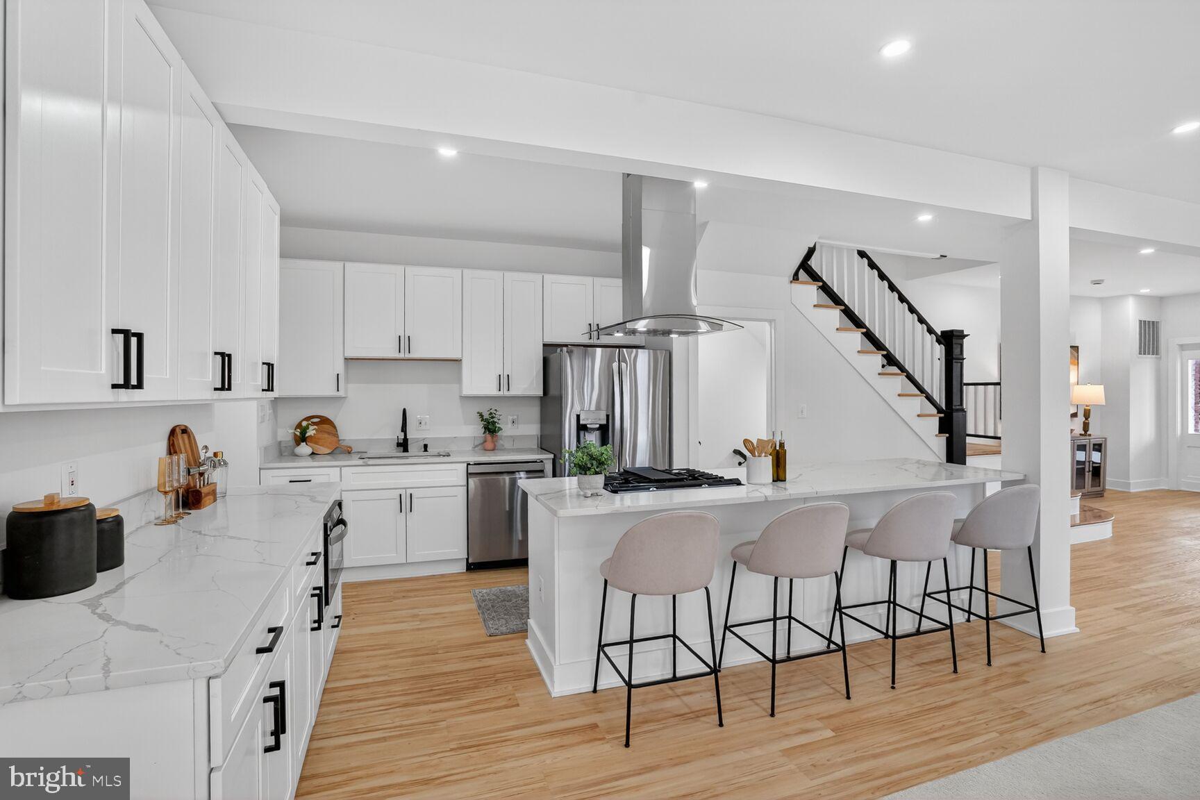 4629 9th Street Northwest Washington, DC 20011 - Photo 10 of 41 a kitchen with appliances cabinets and wooden floor
