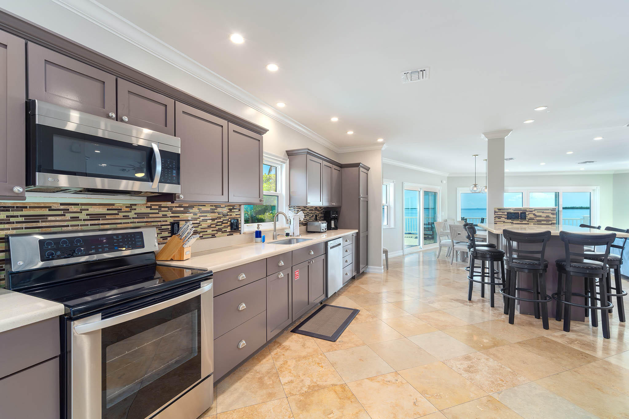31473 Warner Street Big Pine Key, FL 33043 - Photo 12 of 49 a large kitchen with stainless steel appliances