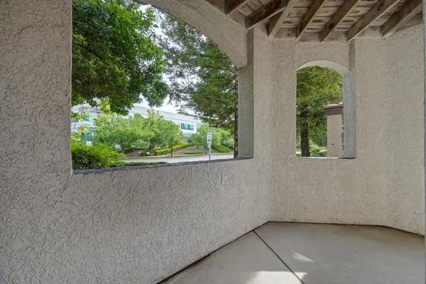 a backyard of a house with a yard and outdoor seating