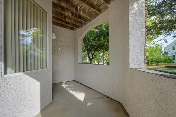 a view of a patio with table and chairs potted plants with wooden floor