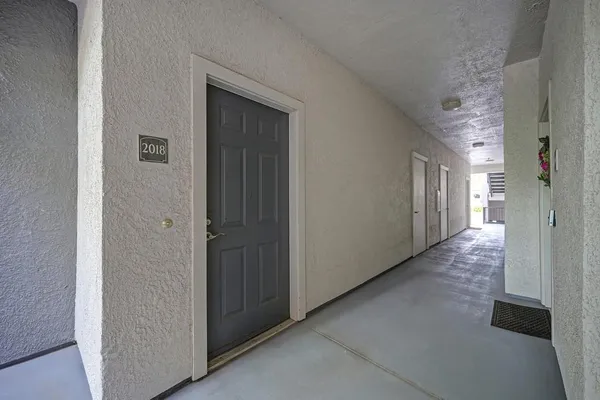 a view of a hallway with closet area