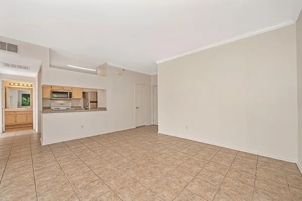 a view of an empty room with a window