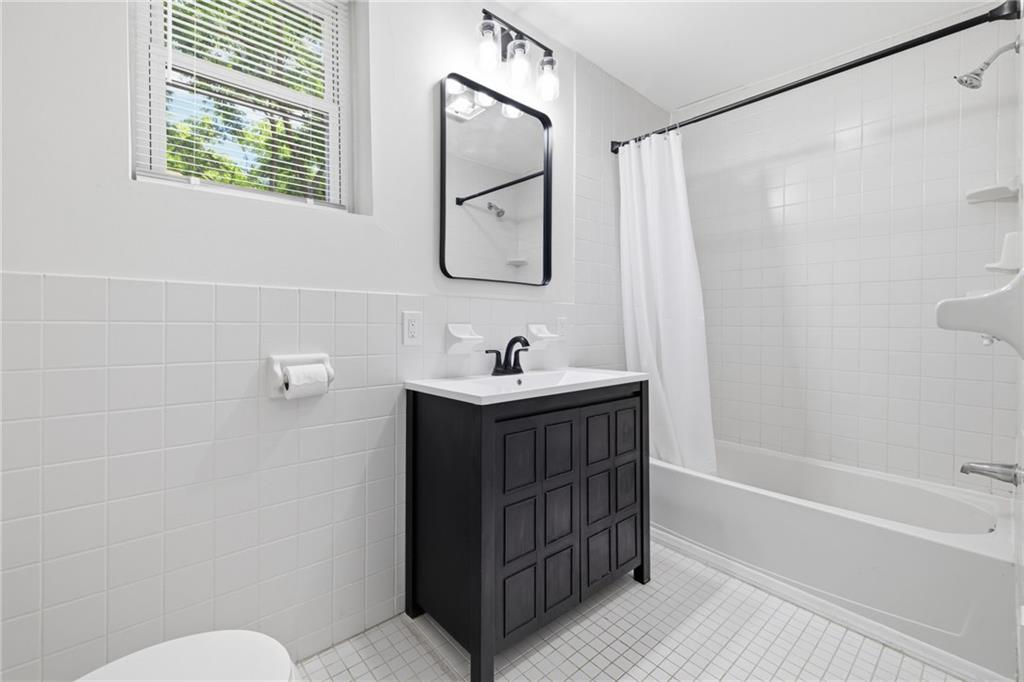 2961 Ruthwood Avenue Pittsburgh, PA 15227 - Photo 21 of 29 a bathroom with a sink and a mirror