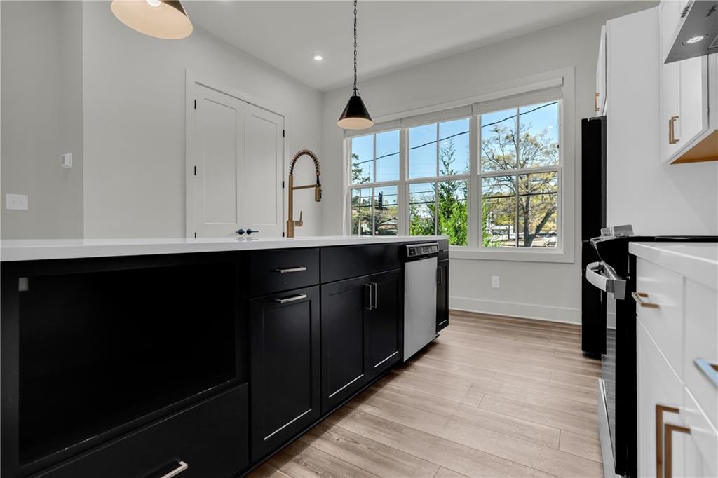 152 Chestnut Circle Atlanta, GA 30342 - Photo 15 of 53 a kitchen with a sink a window and appliances