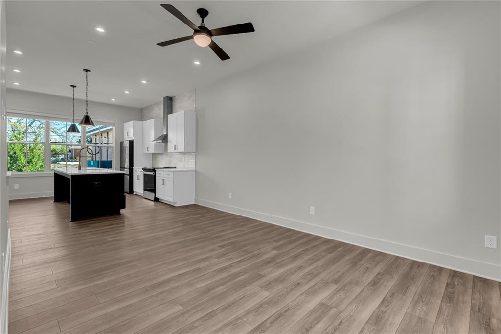 152 Chestnut Circle Atlanta, GA 30342 - Photo 19 of 53 a view of kitchen and hall with wooden floor