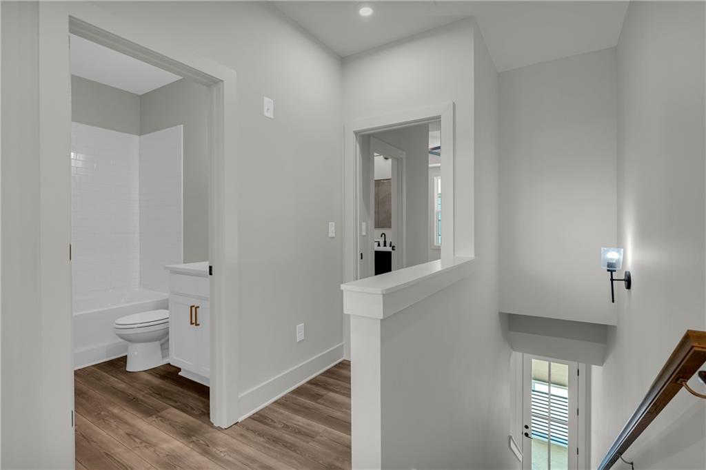 152 Chestnut Circle Atlanta, GA 30342 - Photo 21 of 53 a bathroom with a toilet and a mirror