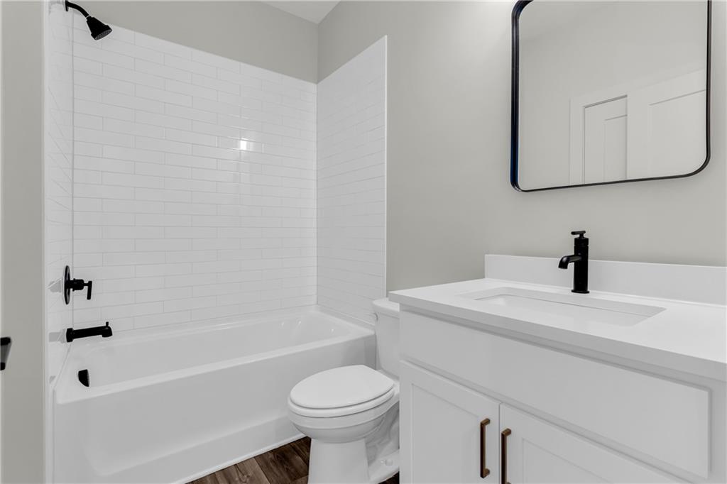 152 Chestnut Circle Atlanta, GA 30342 - Photo 24 of 53 a bathroom with a sink a toilet and shower