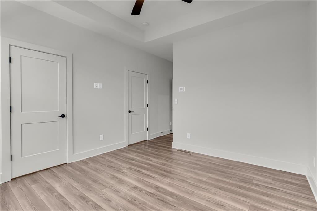 152 Chestnut Circle Atlanta, GA 30342 - Photo 30 of 53 a view of an empty room with wooden floor