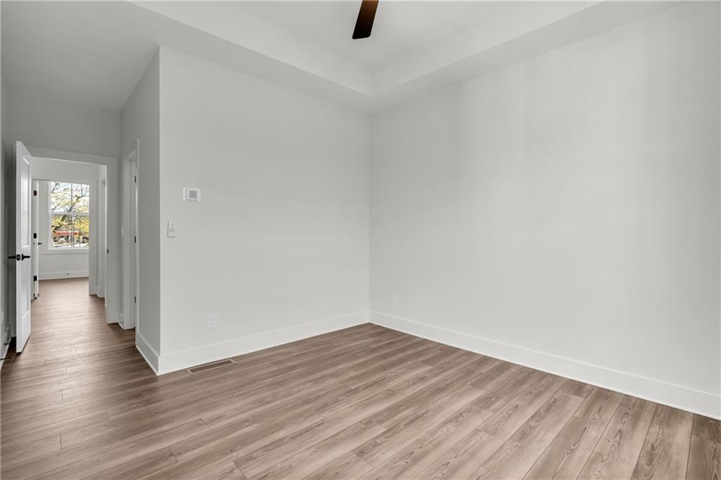 152 Chestnut Circle Atlanta, GA 30342 - Photo 31 of 53 a view of a hallway with wooden floor