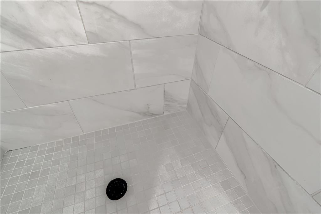 152 Chestnut Circle Atlanta, GA 30342 - Photo 37 of 53 a bathroom with a shower