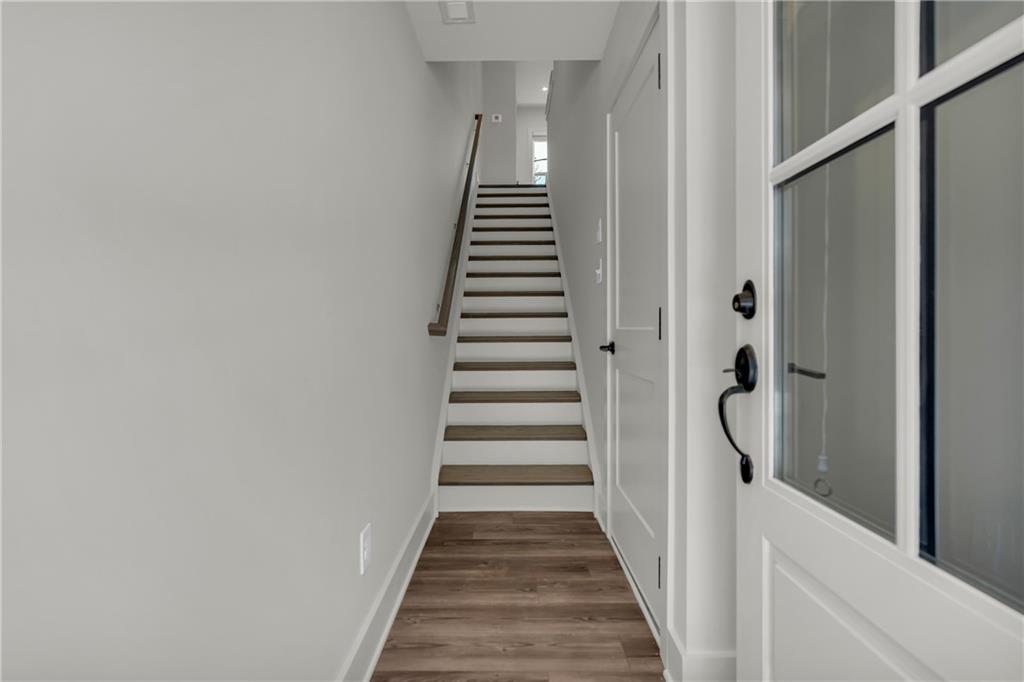 152 Chestnut Circle Atlanta, GA 30342 - Photo 5 of 53 a view of a hallway with wooden floor and entryway