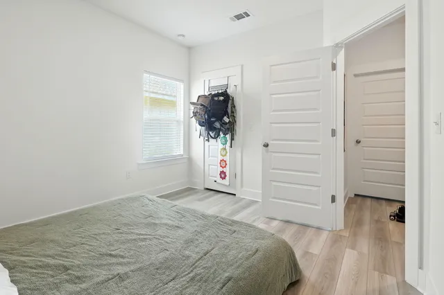 wooden floor and closet in a room