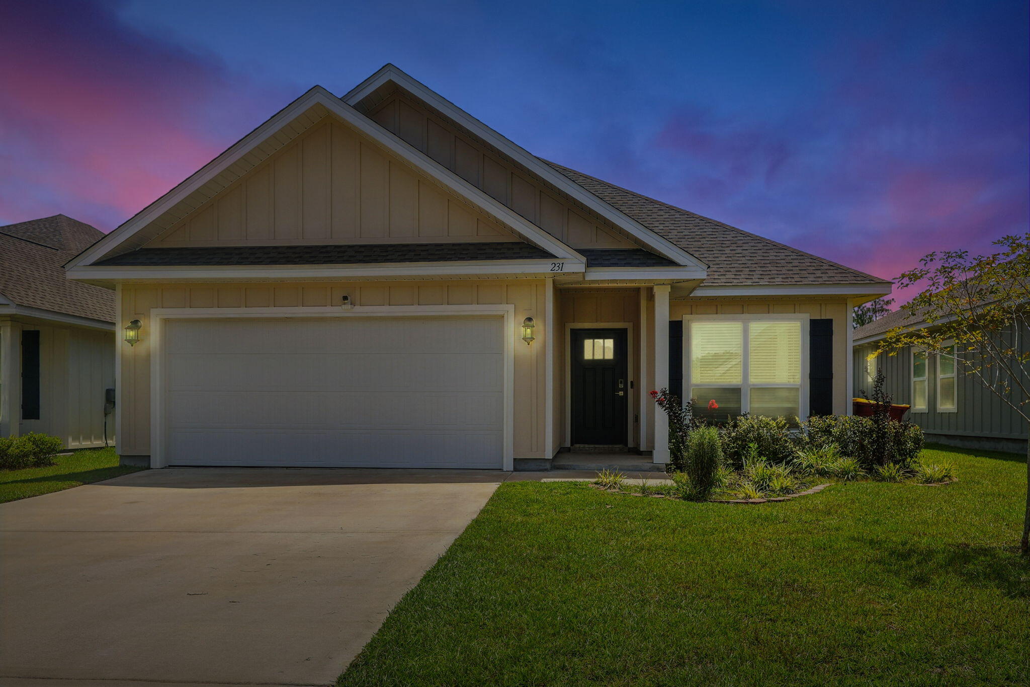 231 Lyla Lane Crestview, FL 32539 - Photo 2 of 30 a front view of a house with garden