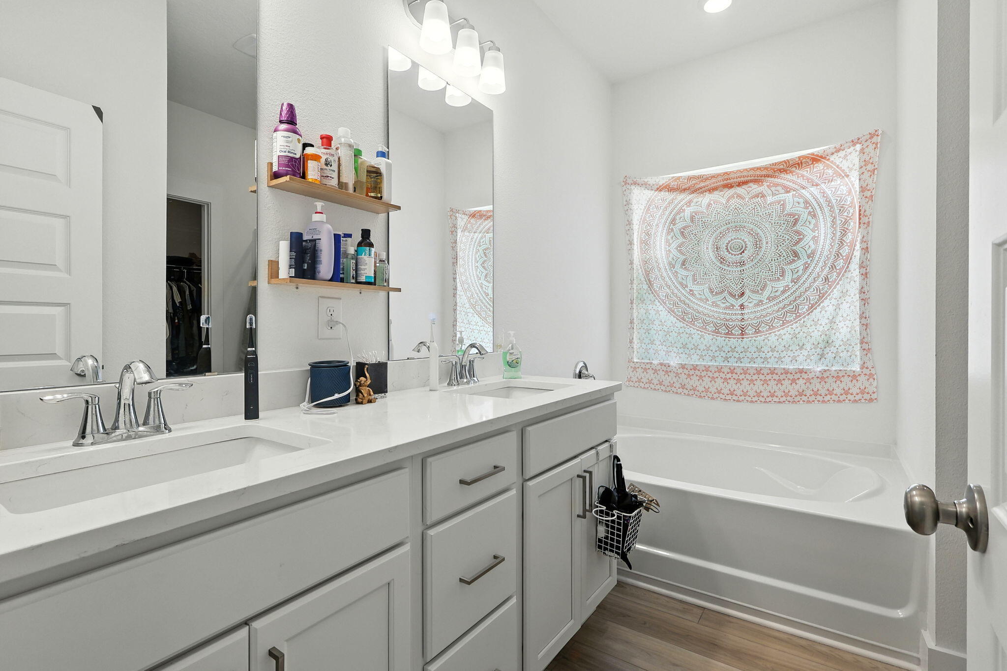 231 Lyla Lane Crestview, FL 32539 - Photo 24 of 30 a bathroom with a tub sink and mirror