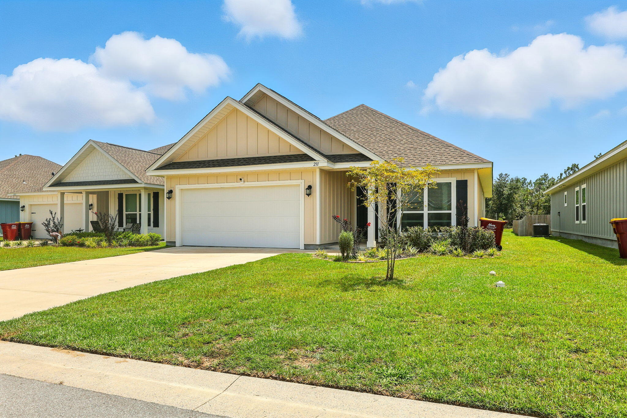 231 Lyla Lane Crestview, FL 32539 - Photo 3 of 30 a front view of a house with a yard and porch