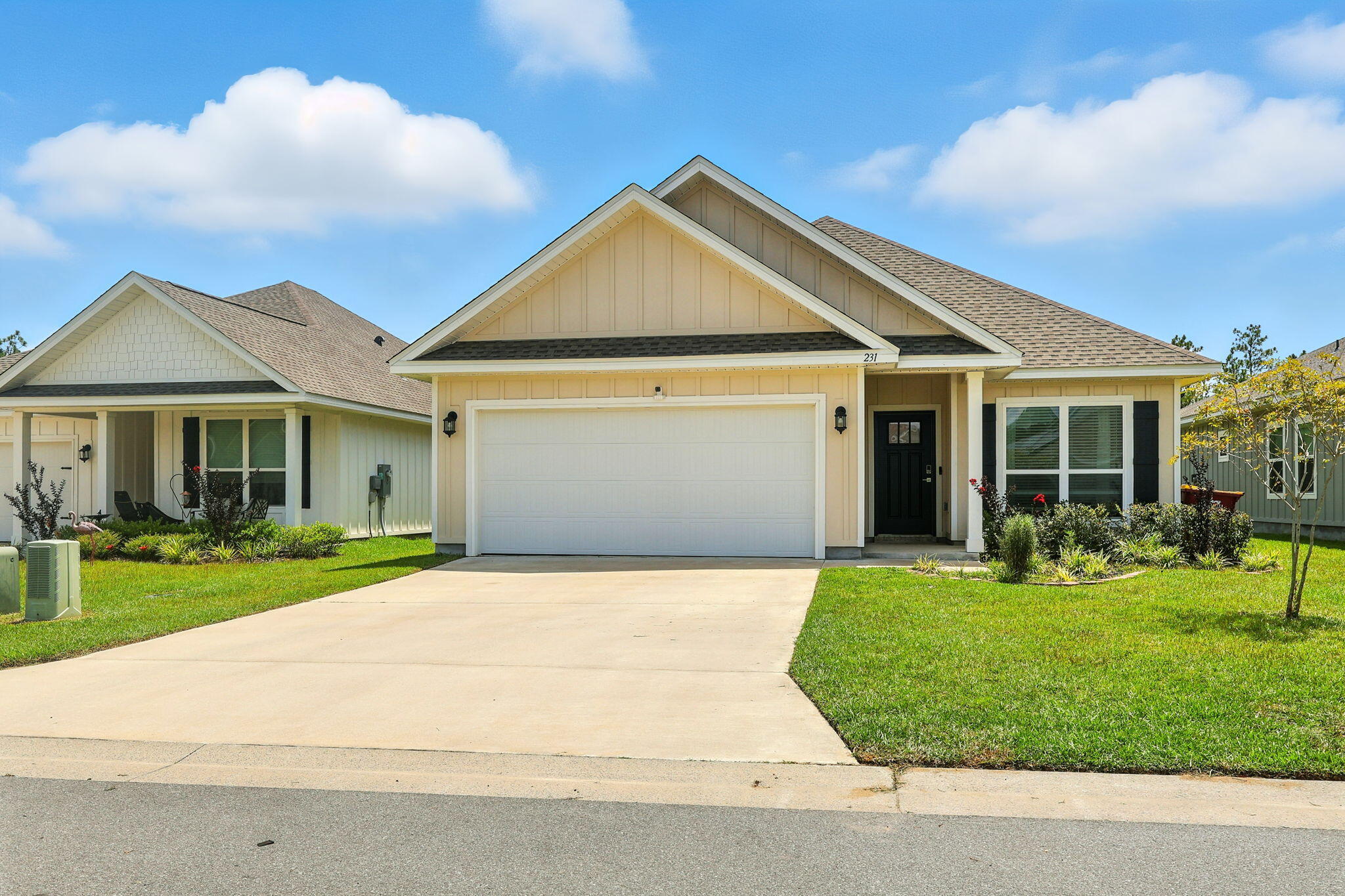 231 Lyla Lane Crestview, FL 32539 - Photo 4 of 30 a front view of a house with a yard and porch