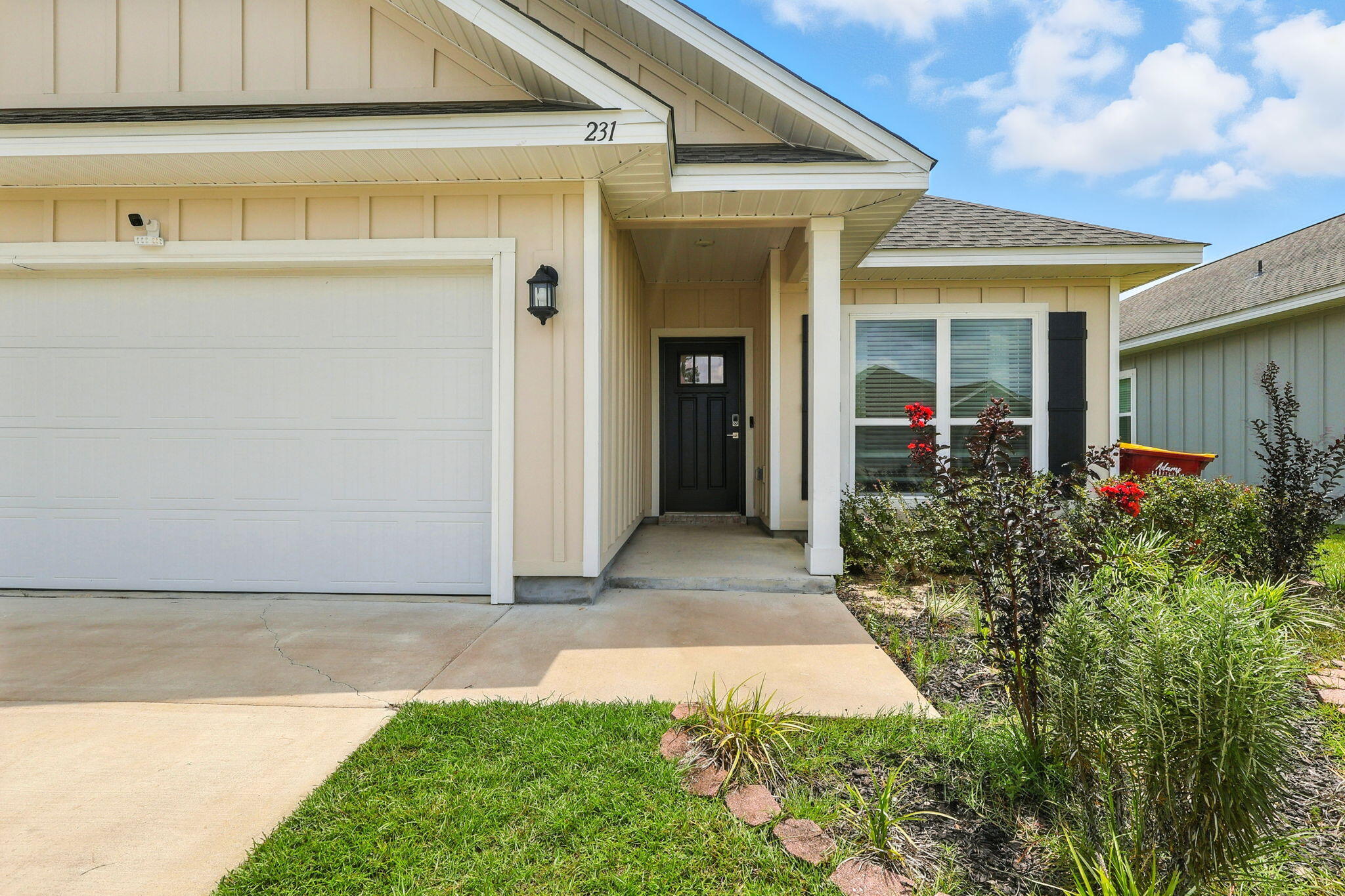 231 Lyla Lane Crestview, FL 32539 - Photo 5 of 30 a front view of a house with garden