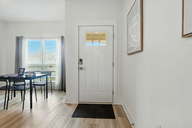 a view of a livingroom with furniture and wooden floor