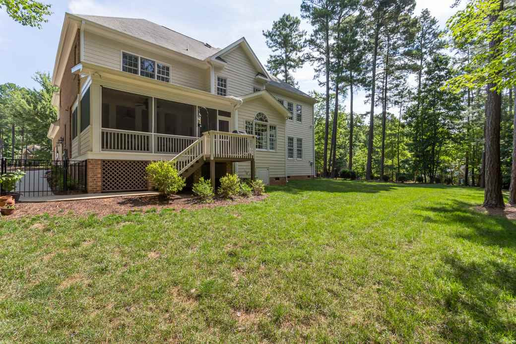 7220 Sunset Glen Point Raleigh, NC 27614 - Photo 24 of 25 The fenced yard is wonderfully kept and the flower beds are ready for your favorite flowers! Exterior Back