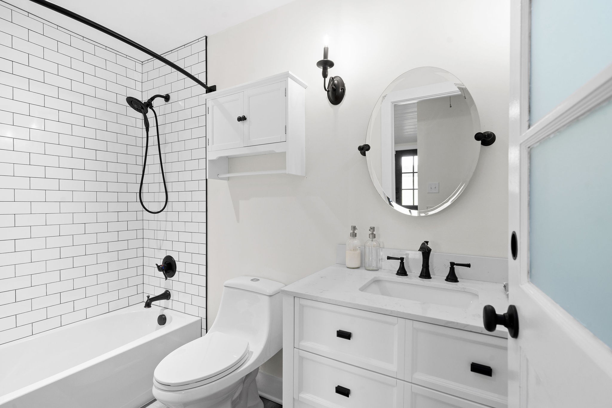 3612 Rossview Road Adams, TN 37010 - Photo 31 of 41 a bathroom with a granite countertop sink a toilet and a mirror