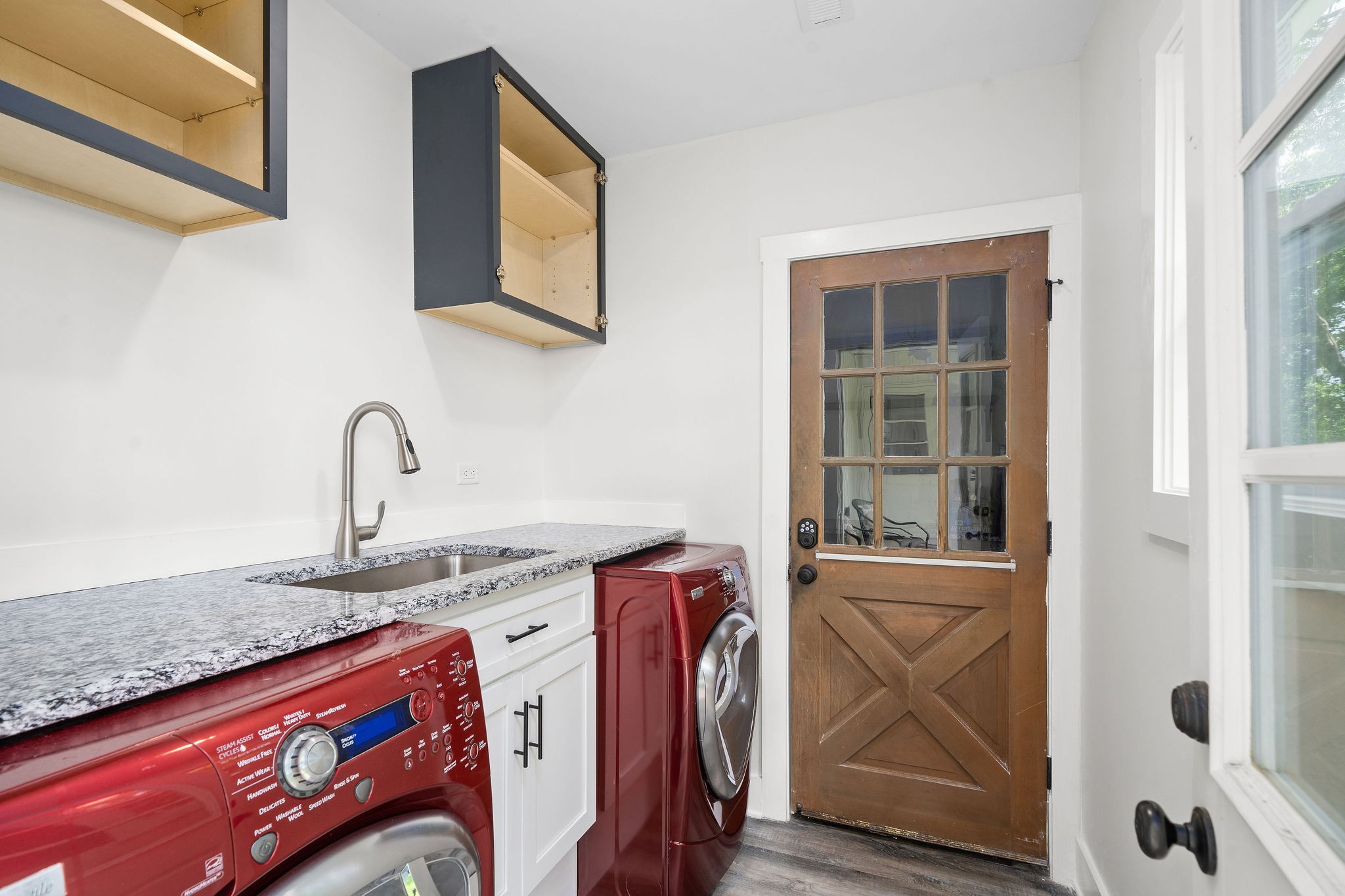 3612 Rossview Road Adams, TN 37010 - Photo 34 of 41 a utility room with stainless steel appliances granite countertop a sink and a window
