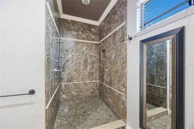 a bathroom with a glass shower door