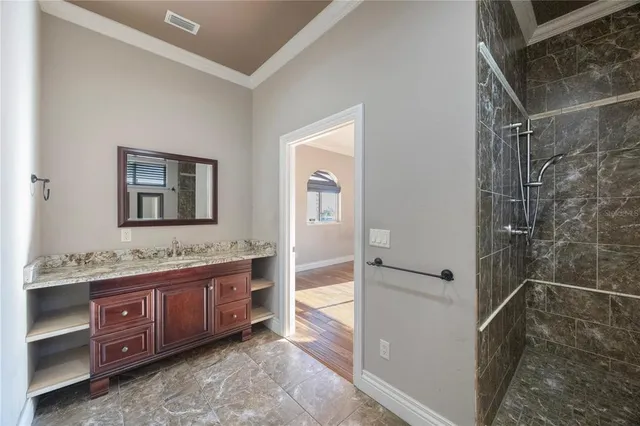 a bathroom with a double vanity sink toilet mirror and bathtub