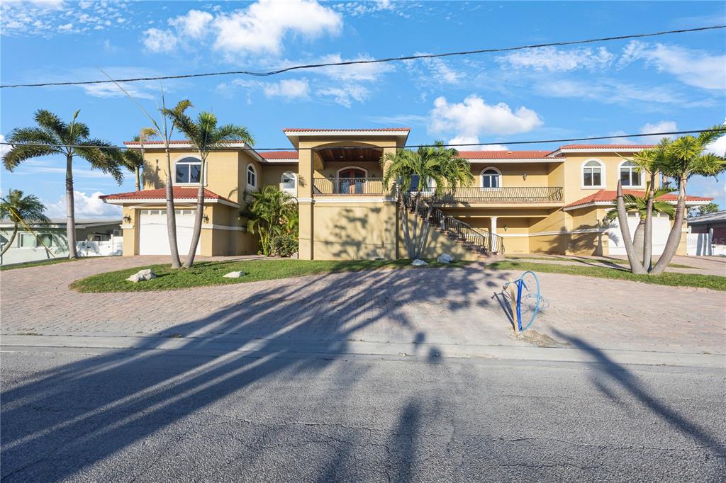 736 Pruitt Drive Madeira Beach, FL 33708 - Photo 2 of 42 a view of a yard with a patio
