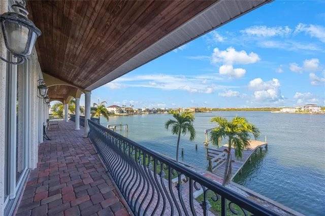 a view of a balcony with wooden floor