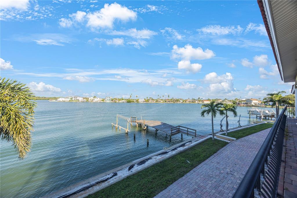 736 Pruitt Drive Madeira Beach, FL 33708 - Photo 30 of 42 a view of a terrace with lawn chairs