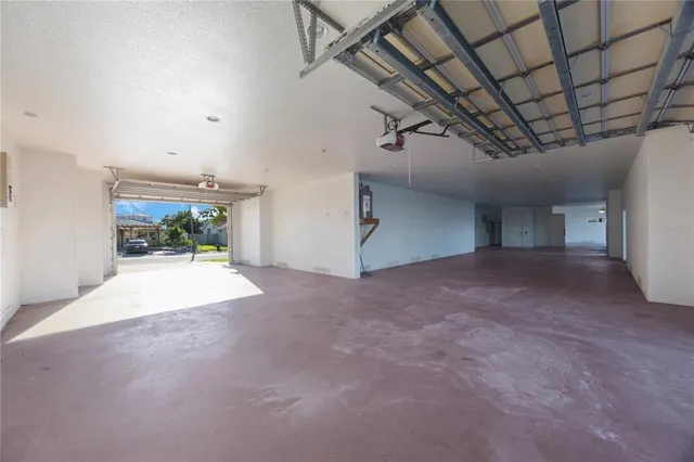 a view of a room with furniture and a garage