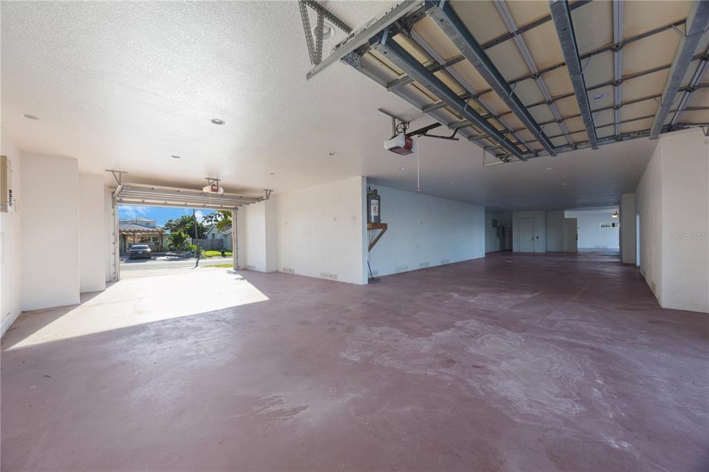 736 Pruitt Drive Madeira Beach, FL 33708 - Photo 35 of 42 a view of a room with furniture and a garage