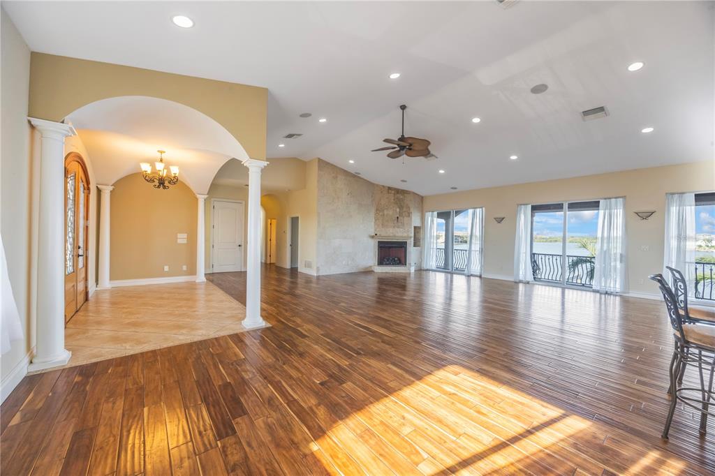 736 Pruitt Drive Madeira Beach, FL 33708 - Photo 7 of 42 a view of a living room and kitchen with a hardwood floor