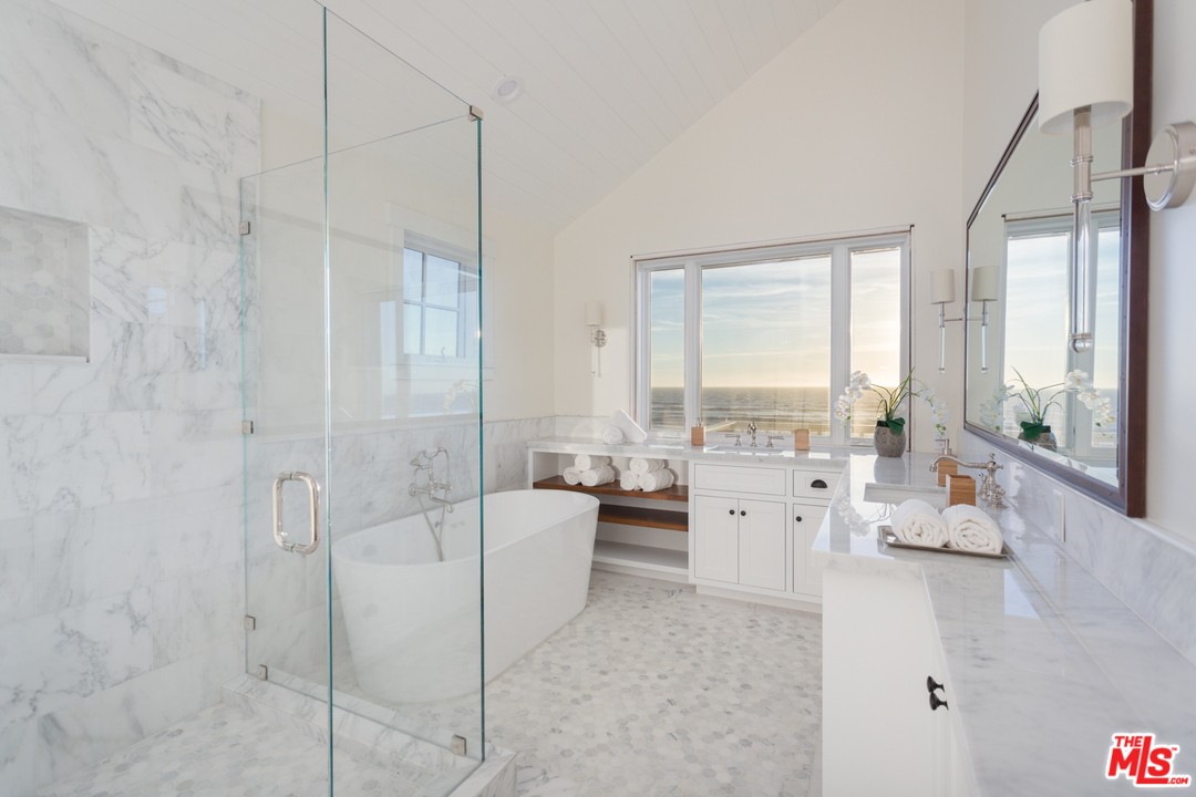 861 Mandalay Beach Road Oxnard, CA 93035 - Photo 17 of 31 a large white room with a large window and a fireplace