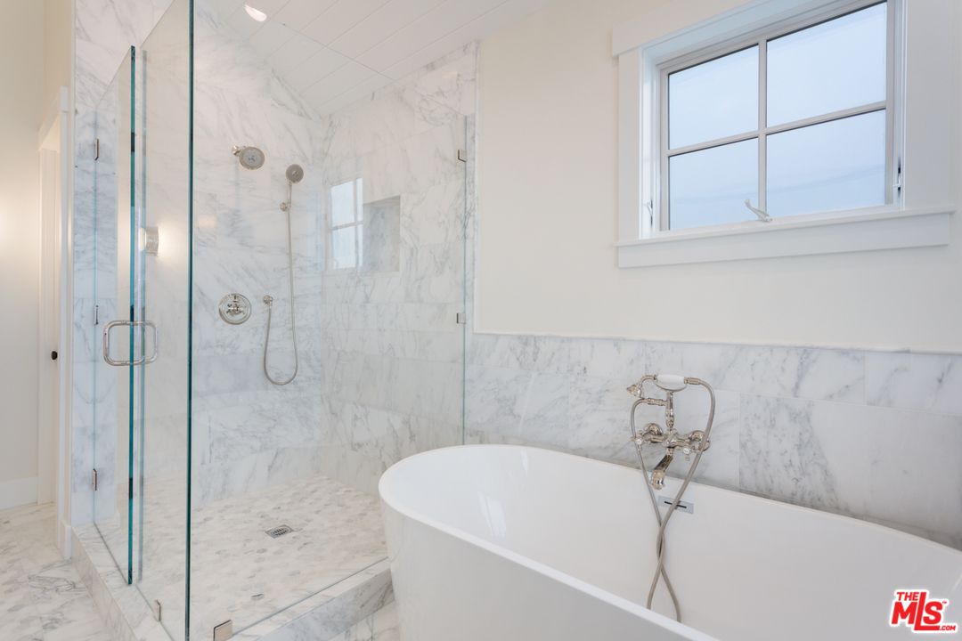 861 Mandalay Beach Road Oxnard, CA 93035 - Photo 18 of 31 a bathroom with a tub and shower