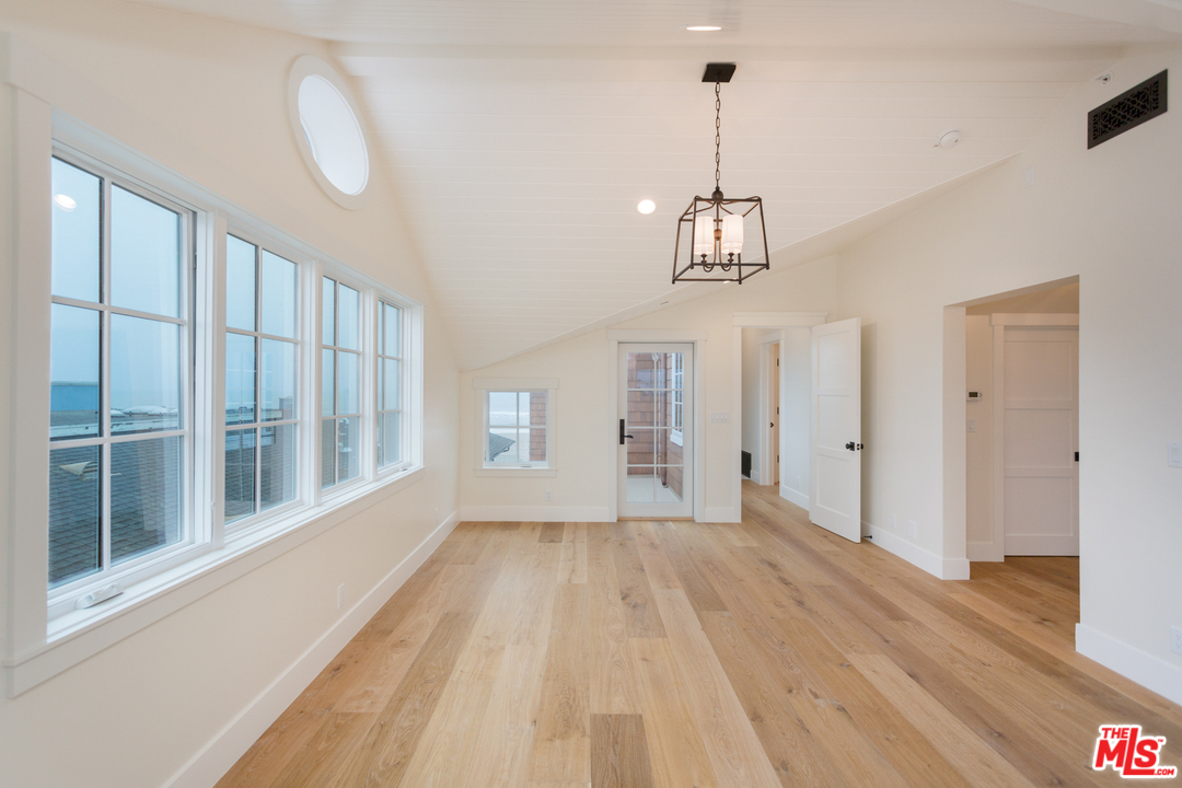 861 Mandalay Beach Road Oxnard, CA 93035 - Photo 26 of 31 a view of empty room with wooden floor and fan