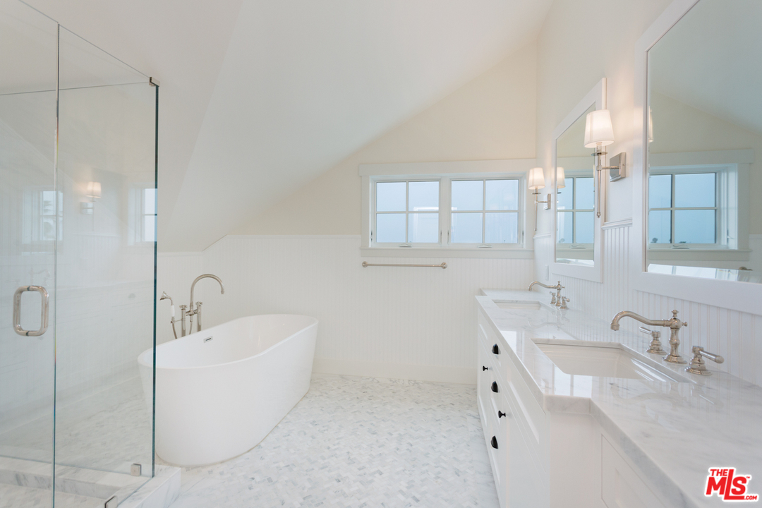 861 Mandalay Beach Road Oxnard, CA 93035 - Photo 28 of 31 a bathroom with a tub sink and mirror