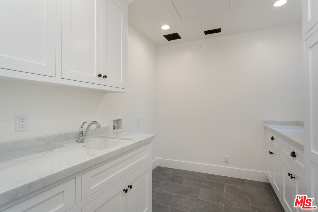 861 Mandalay Beach Road Oxnard, CA 93035 - Photo 31 of 31 a bathroom with a sink and vanity