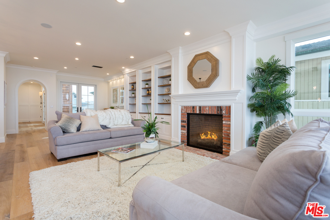 861 Mandalay Beach Road Oxnard, CA 93035 - Photo 5 of 31 a living room with furniture and a fireplace