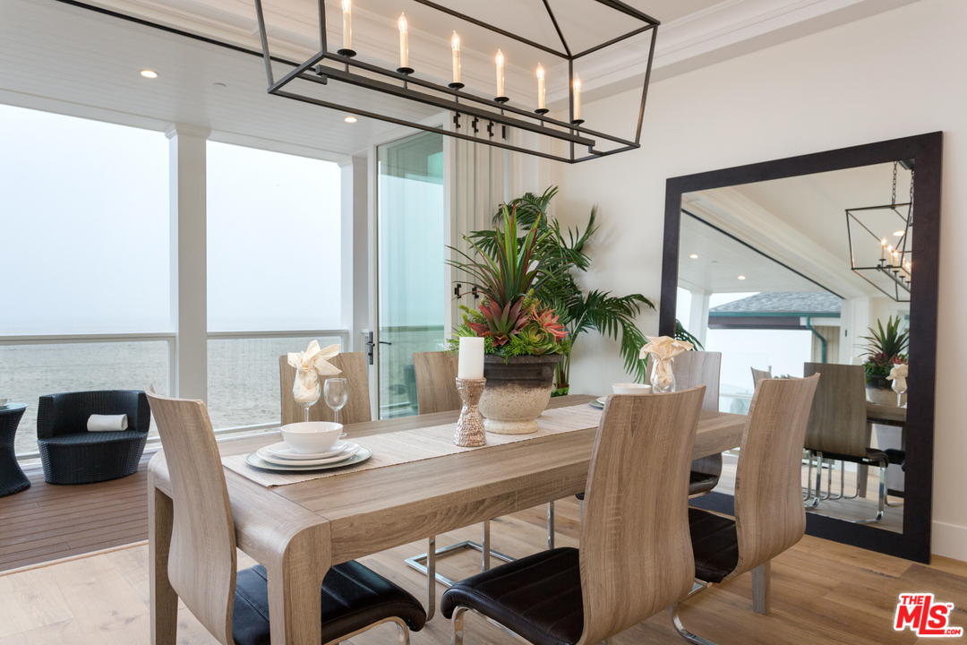 861 Mandalay Beach Road Oxnard, CA 93035 - Photo 6 of 31 a view of a dining room with furniture and a potted plant