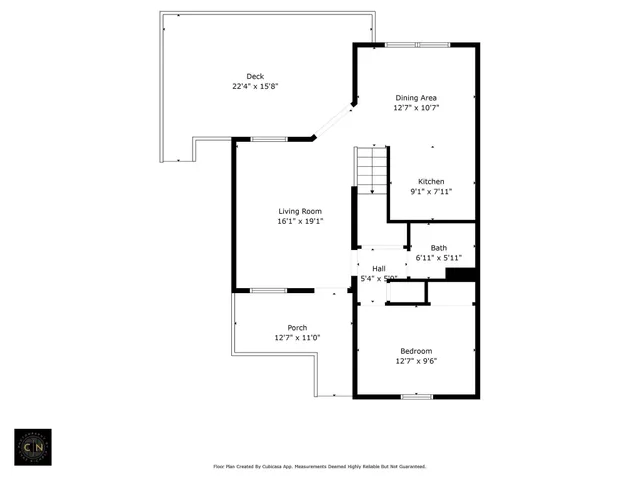 a picture of a bench in front of a wall