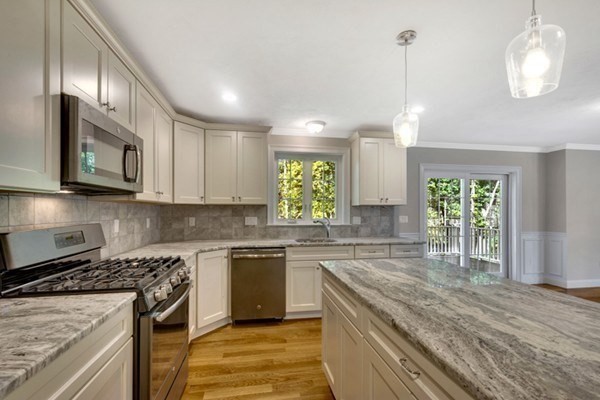 11 Wilson Road Berlin, MA 01503 - Photo 6 of 15 a kitchen with stainless steel appliances granite countertop wooden cabinets a stove top oven a sink and dishwasher