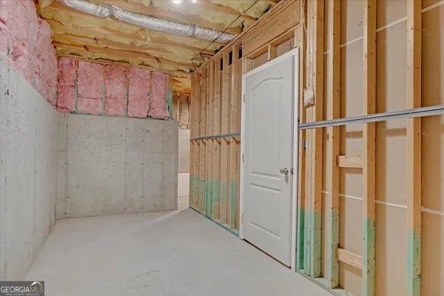 a bathroom with a shower and a glass door