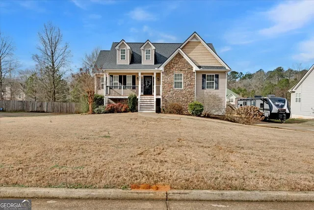 a front view of a house with a yard